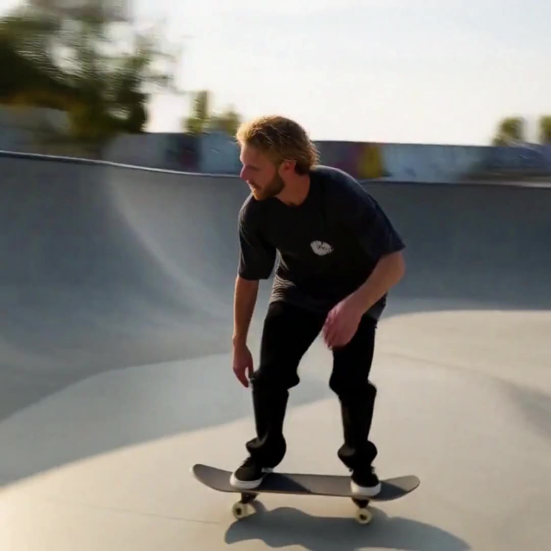Actual DeepAny Studio start-and-end-frame result: a skateboarder drops into a bowl, carves the wall and flips, with a camera that swoops with the rider.